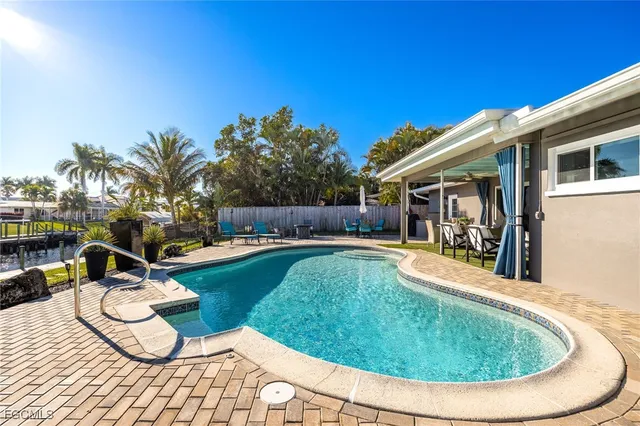 a view of a swimming pool with a patio