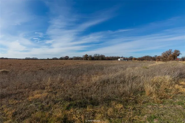 a view of a lake with houses in the back