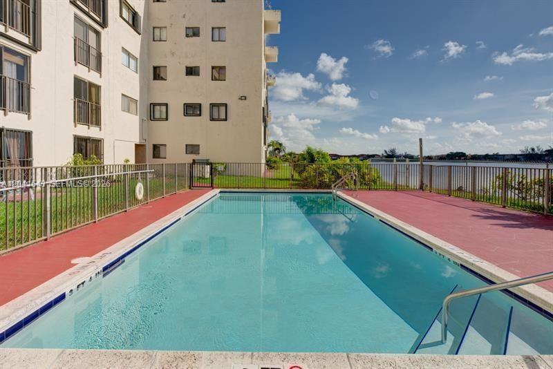 9915 West Okeechobee Road, Unit 2404 Hialeah Gardens, FL 33016 - Photo 3 of 5 a view of an outdoor space and yard