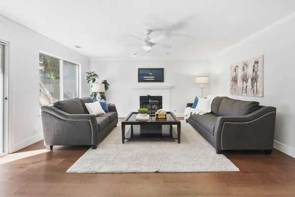 a living room with furniture and a fireplace