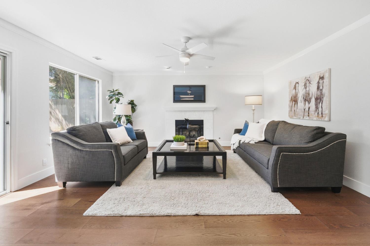 3718 Maidu Place Davis, CA 95618 - Photo 11 of 50 a living room with furniture and a fireplace