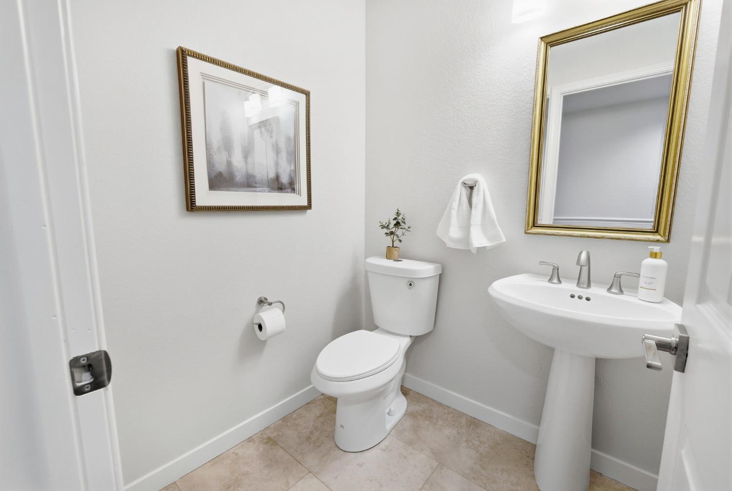 3718 Maidu Place Davis, CA 95618 - Photo 20 of 50 a bathroom with a toilet sink and mirror