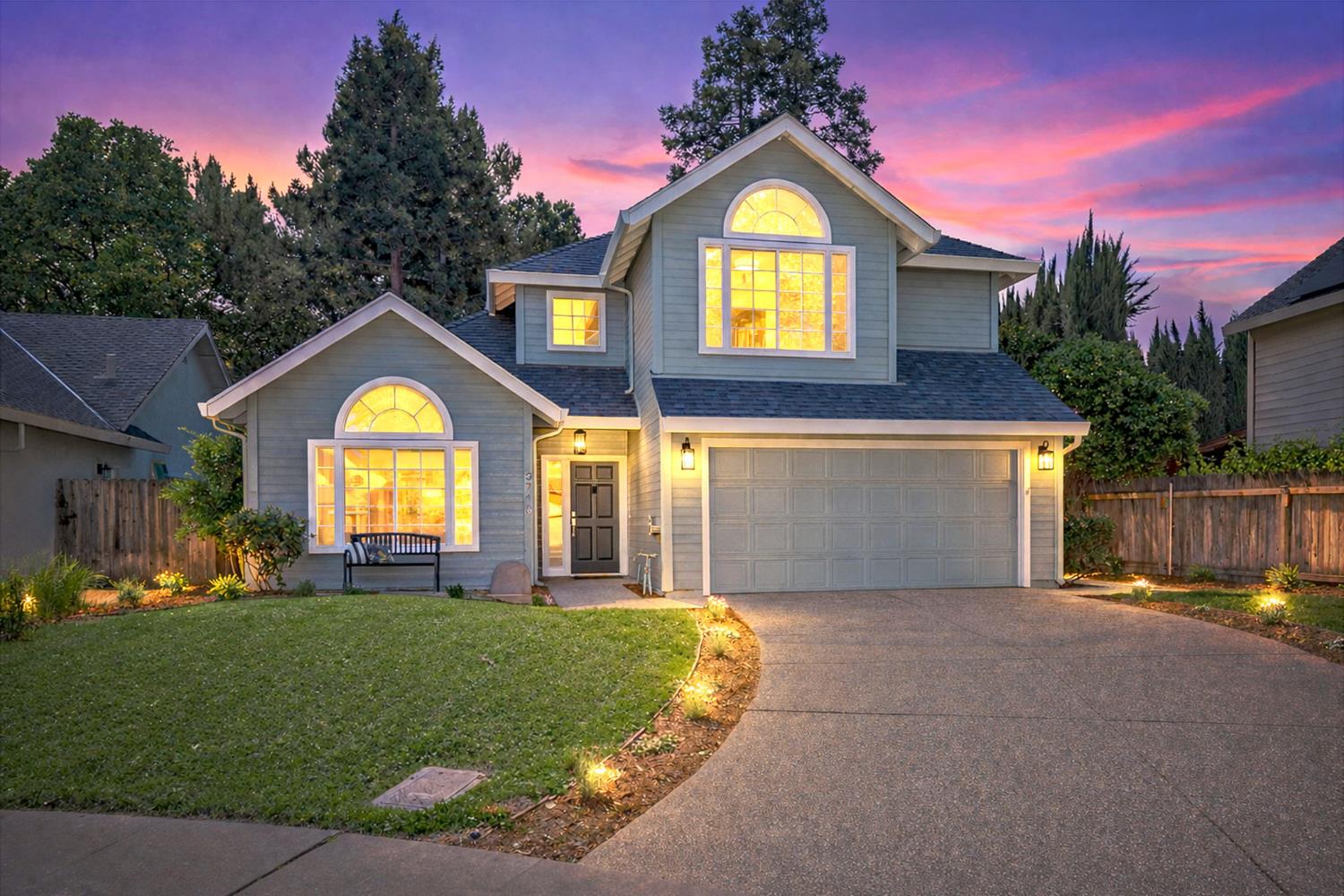 3718 Maidu Place Davis, CA 95618 - Photo 2 of 50 a front view of a house with a big yard and large trees