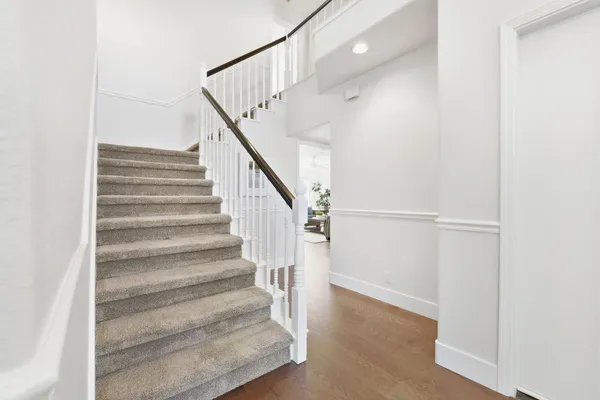 a spacious bedroom with a bed and a window
