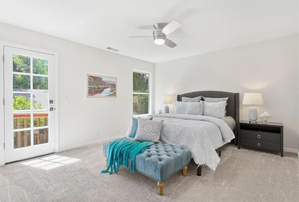 a view of balcony with wooden floor and fence