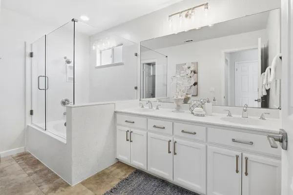 a bathroom with a bathtub and a shower