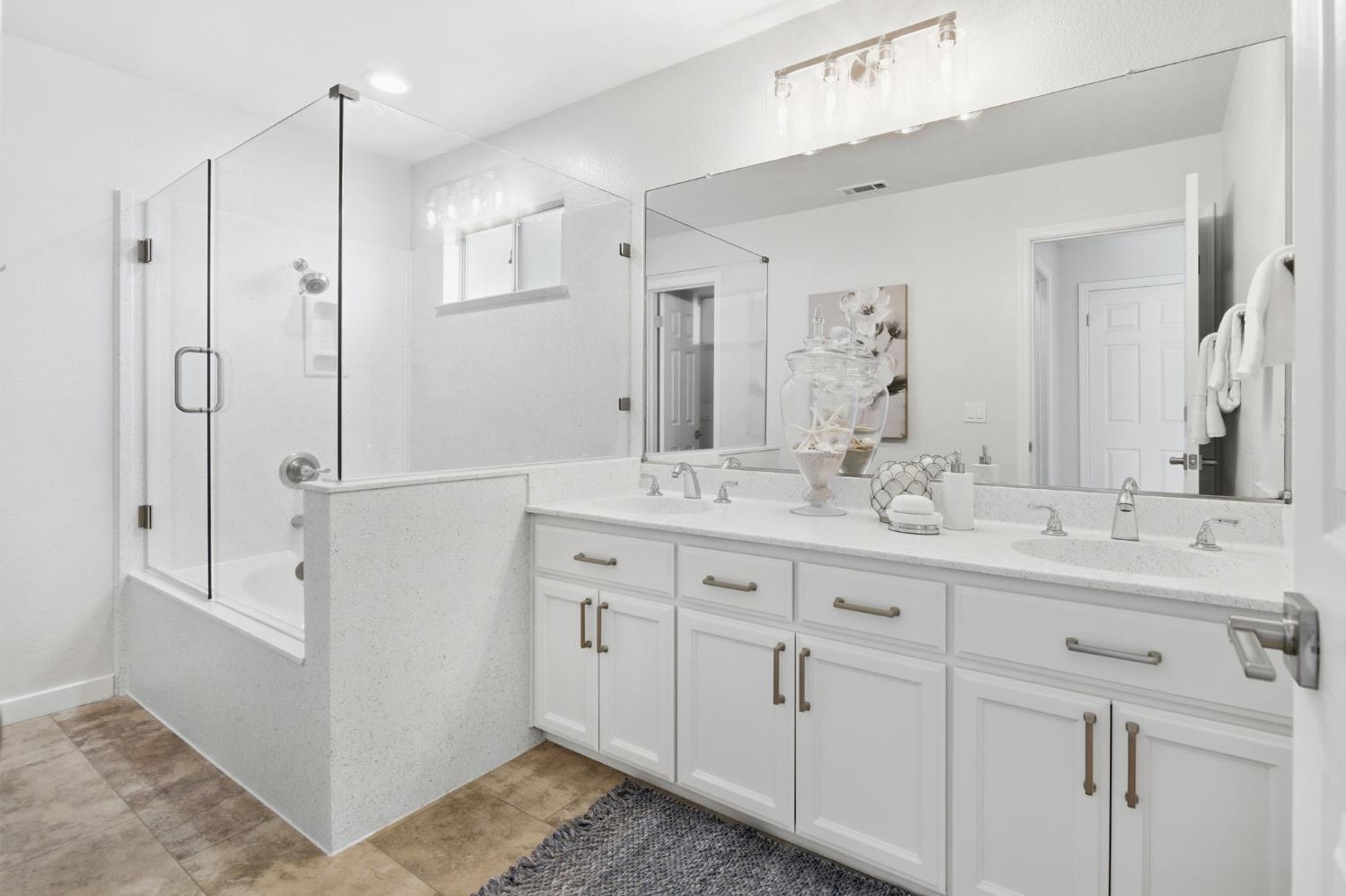 3718 Maidu Place Davis, CA 95618 - Photo 25 of 50 a bathroom with double vanity sink and a mirror