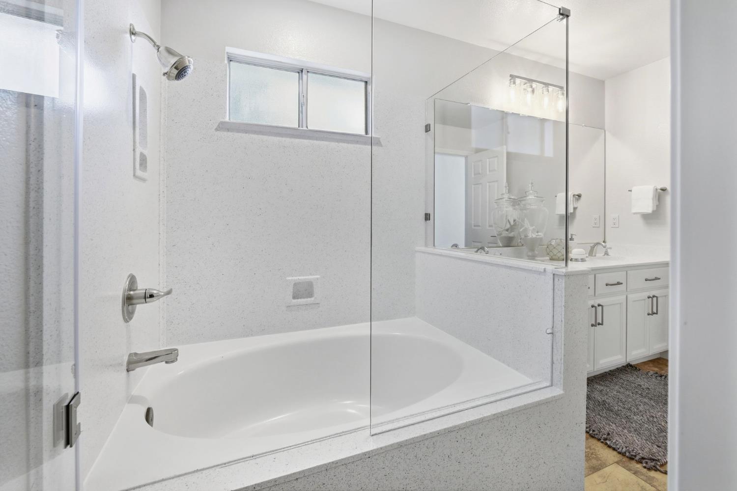 3718 Maidu Place Davis, CA 95618 - Photo 26 of 50 a bathroom with a bathtub and a shower