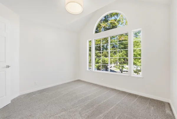 a bathroom with a double vanity sink toilet and shower