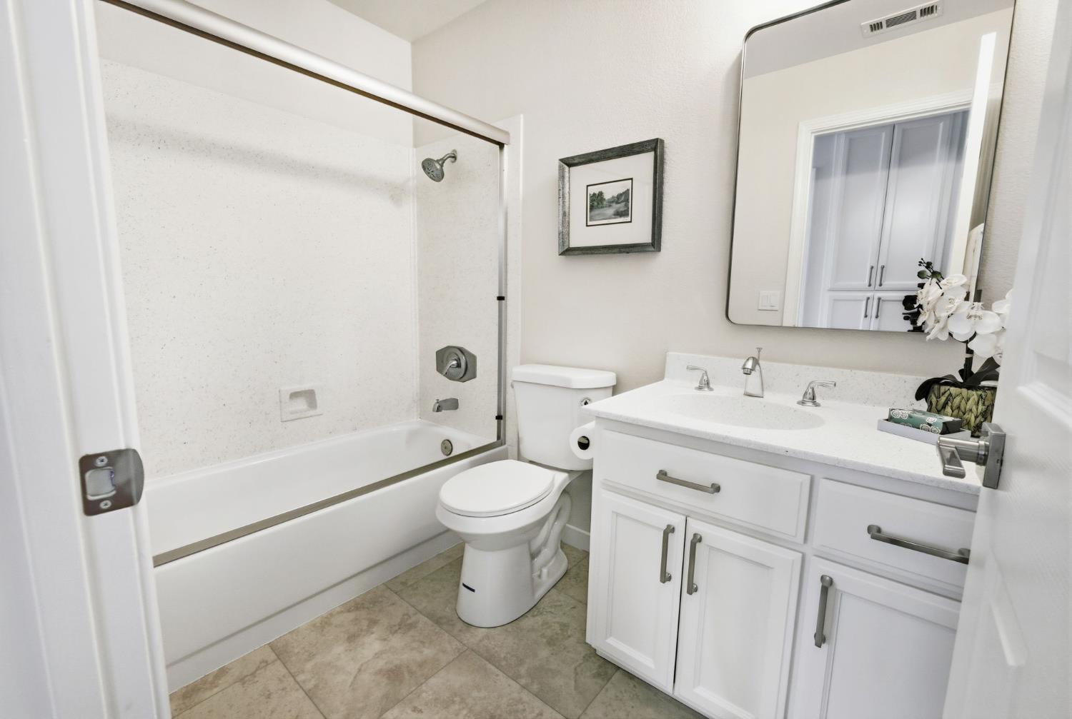 3718 Maidu Place Davis, CA 95618 - Photo 31 of 50 a bathroom with a double vanity sink toilet and shower