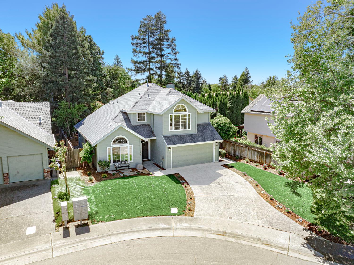 3718 Maidu Place Davis, CA 95618 - Photo 35 of 50 a front view of a house with a garden and trees