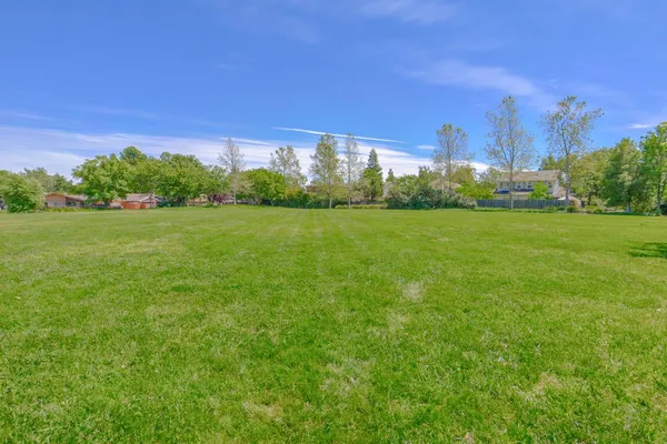 a view of a playground with basketball court