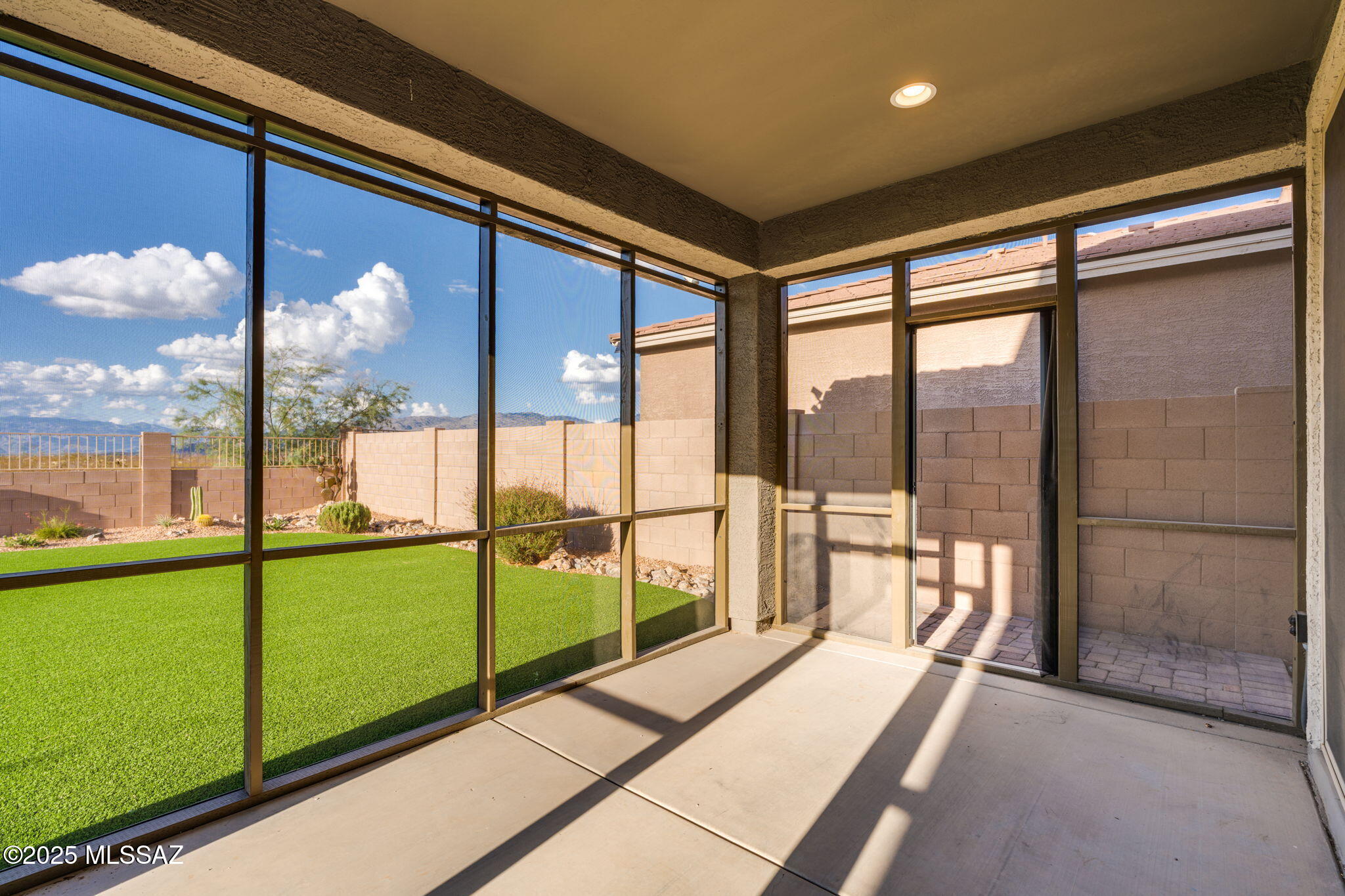 12100 East Ryscott Circle Vail, AZ 85641 - Photo 38 of 53 a view of an empty room with a large window