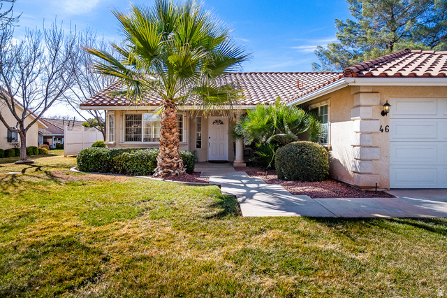1825 West Mathis Park Place, Unit 46 St. George, UT 84770 - Photo 8 of 45 View of front facade with a front lawn, stucco siding, and a tile roof