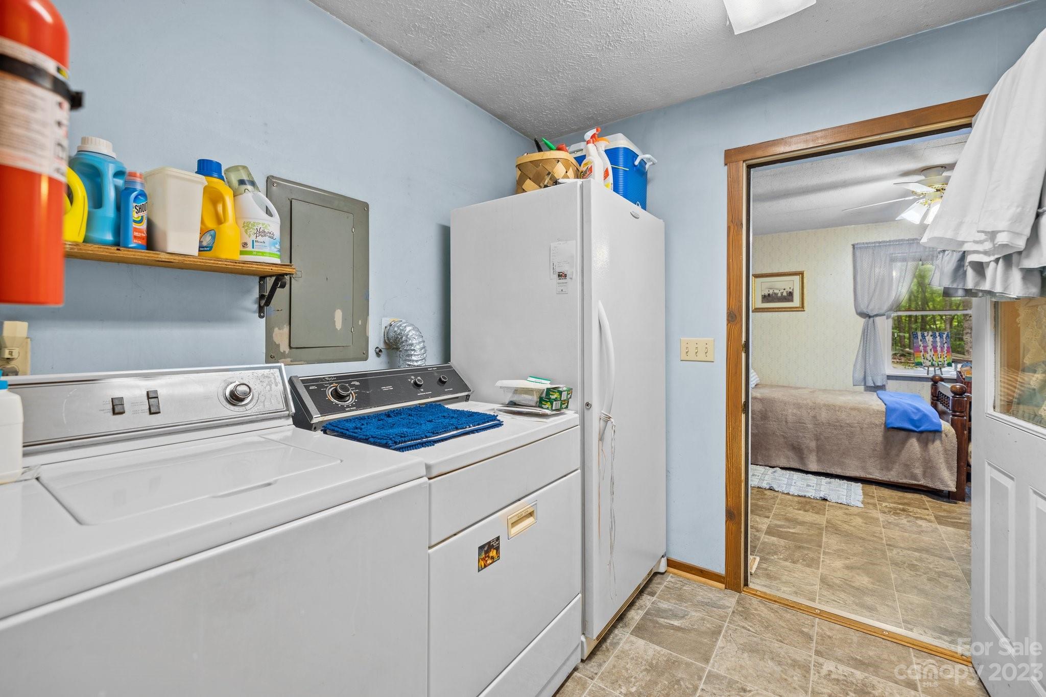 6906 Newman Road Waxhaw, NC 28173 - Photo 19 of 23 a kitchen with a refrigerator and a stove