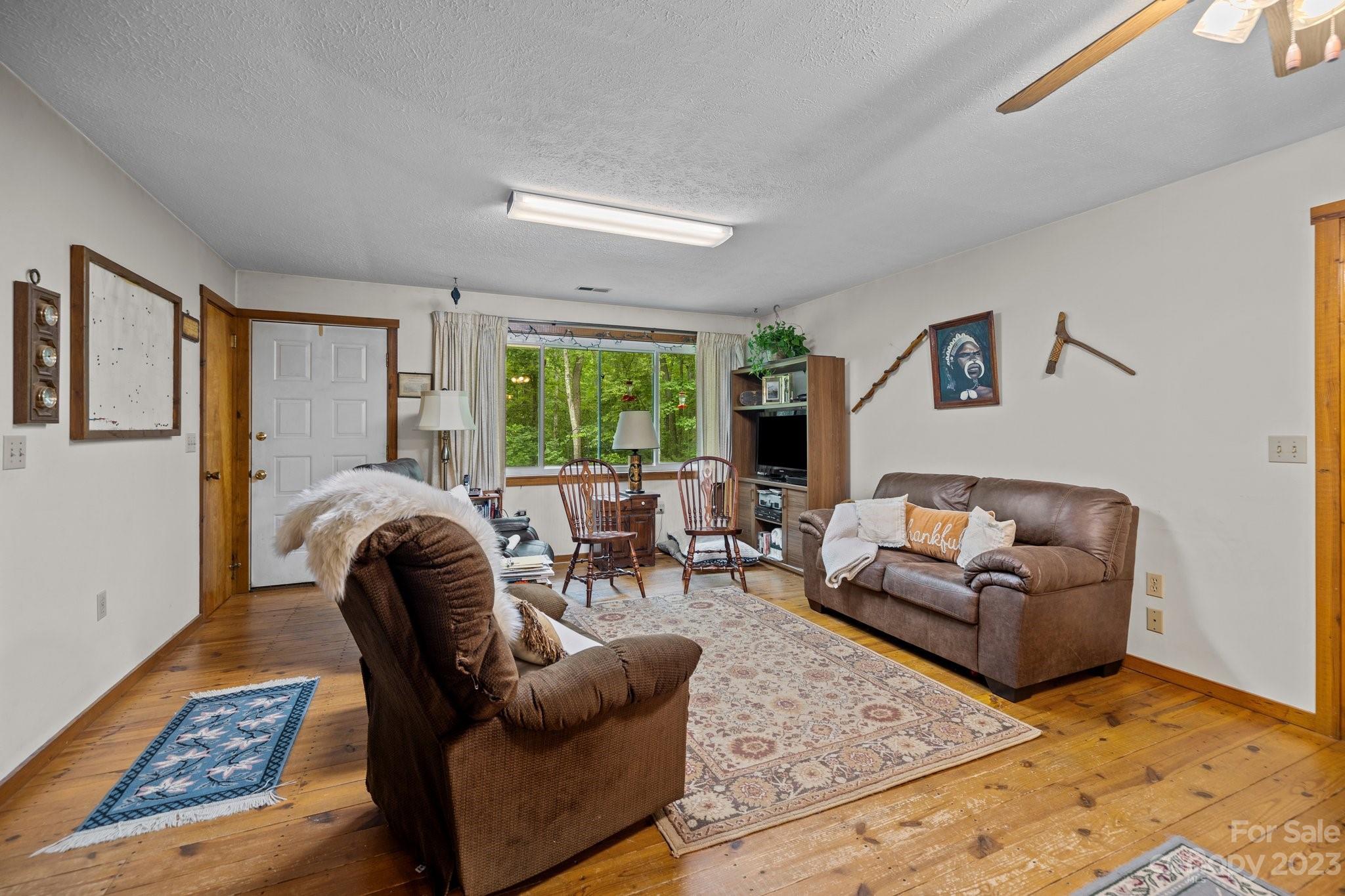 6906 Newman Road Waxhaw, NC 28173 - Photo 5 of 23 a living room with furniture and a large window