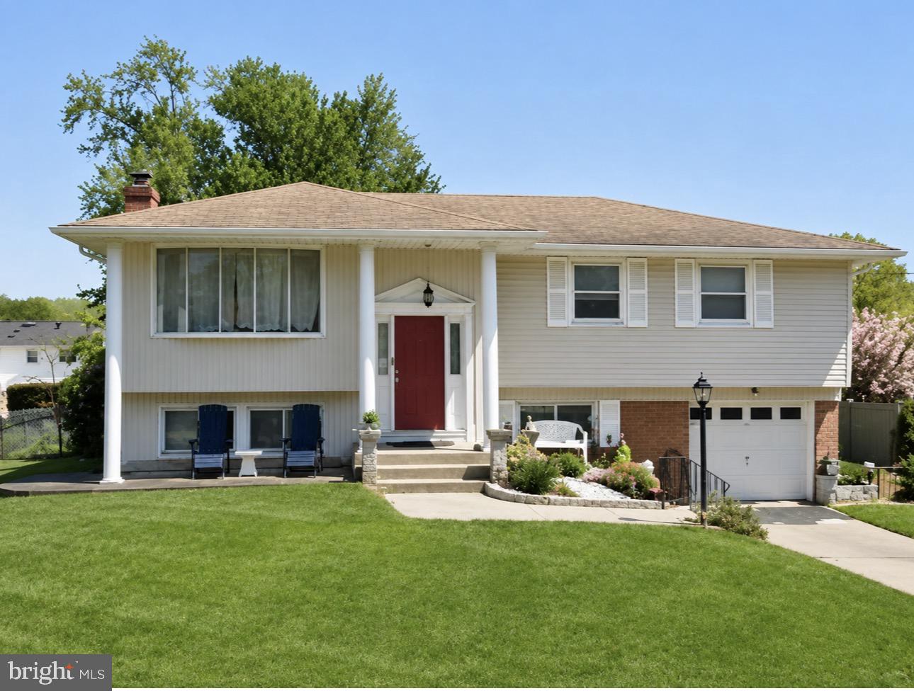 52 Haines Mill Road Delran, NJ 08075 - Photo 1 of 1 a front view of a house with a garden and yard