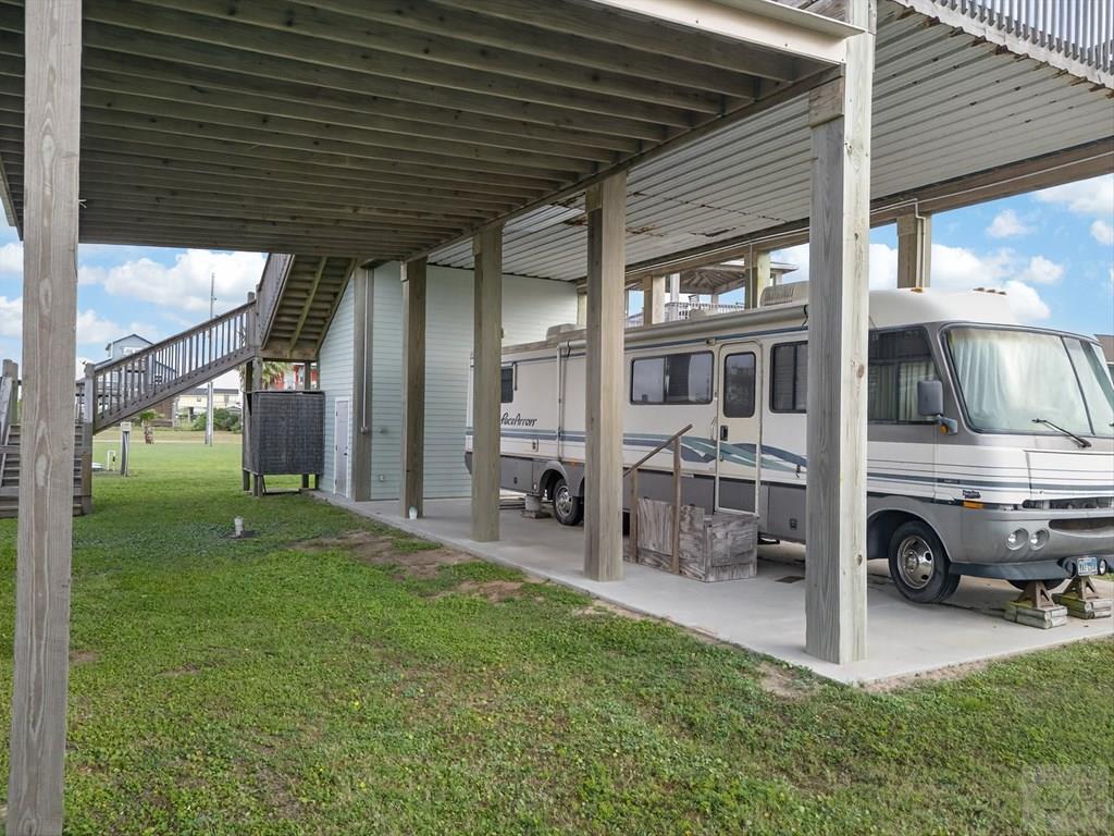 1739 Pompano Lane Crystal Beach, TX 77650 - Photo 4 of 20 a view of a porch with chairs and backyard