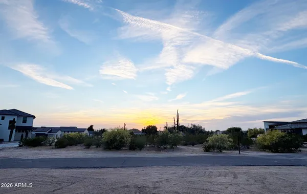 a view of a road with a building in the background