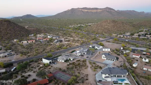 an aerial view of residential houses with outdoor space