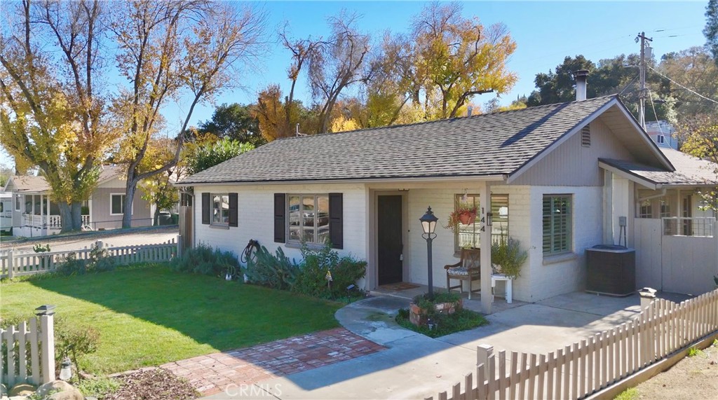 144 12th Street Paso Robles, CA 93446 - Photo 1 of 1 a front view of a house with garden
