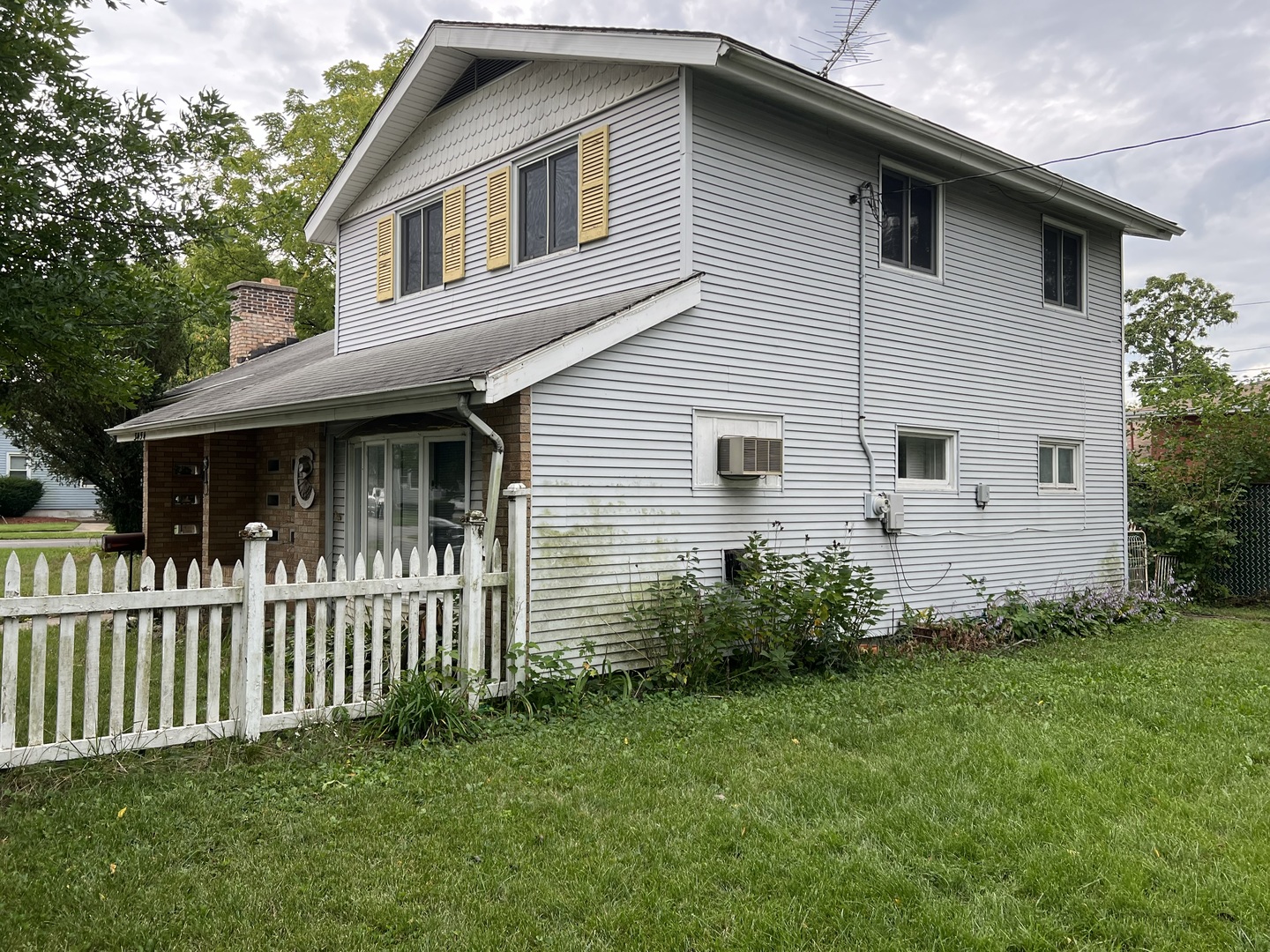 3454 Monroe Street Lansing, IL 60438 - Photo 2 of 4 a front view of a house with a garden