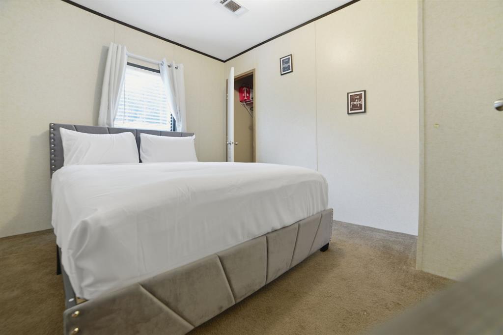 127 Almond Road Minden, LA 71055 - Photo 19 of 25 a bedroom with a bed and a window