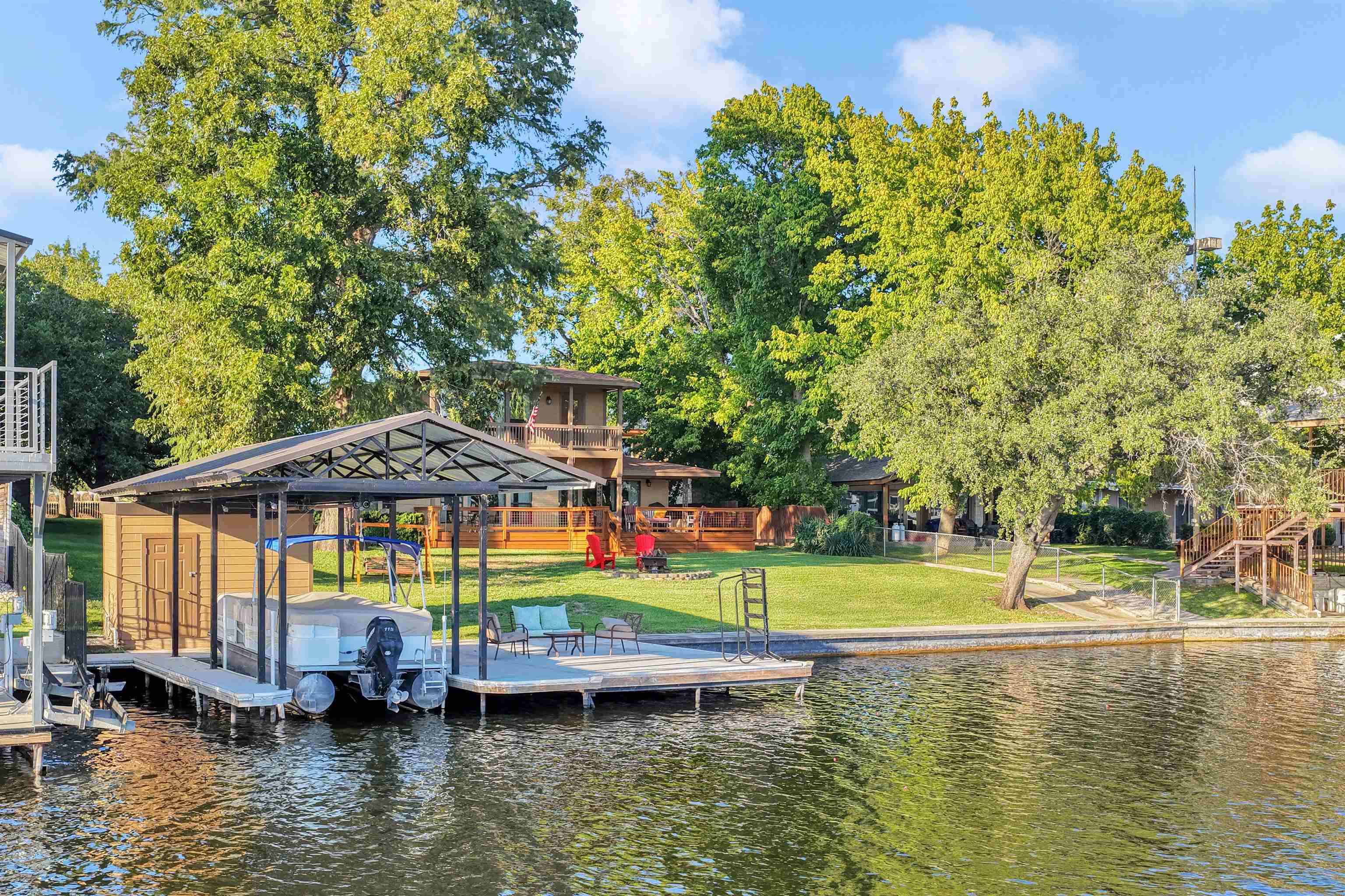 539 Ellen Williams Loop Kingsland, TX 78639 - Photo 1 of 30 a view of a swimming pool with lawn chairs under an umbrella
