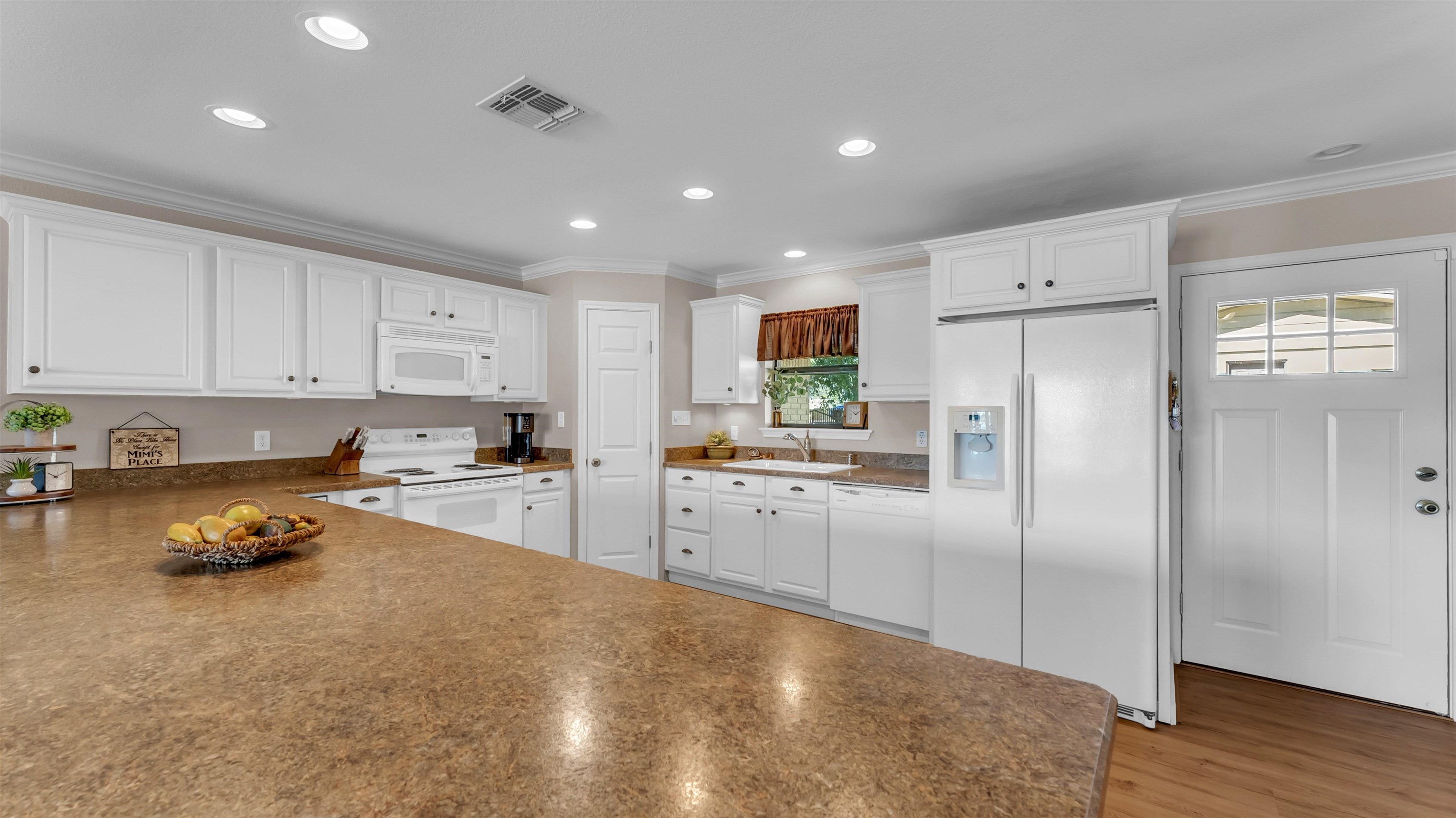 539 Ellen Williams Loop Kingsland, TX 78639 - Photo 11 of 30 a kitchen that has a lot of cabinets and refrigerator in it
