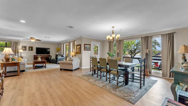 a view of a livingroom with furniture window and wooden floor