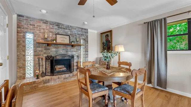 a dining room with furniture and a fireplace