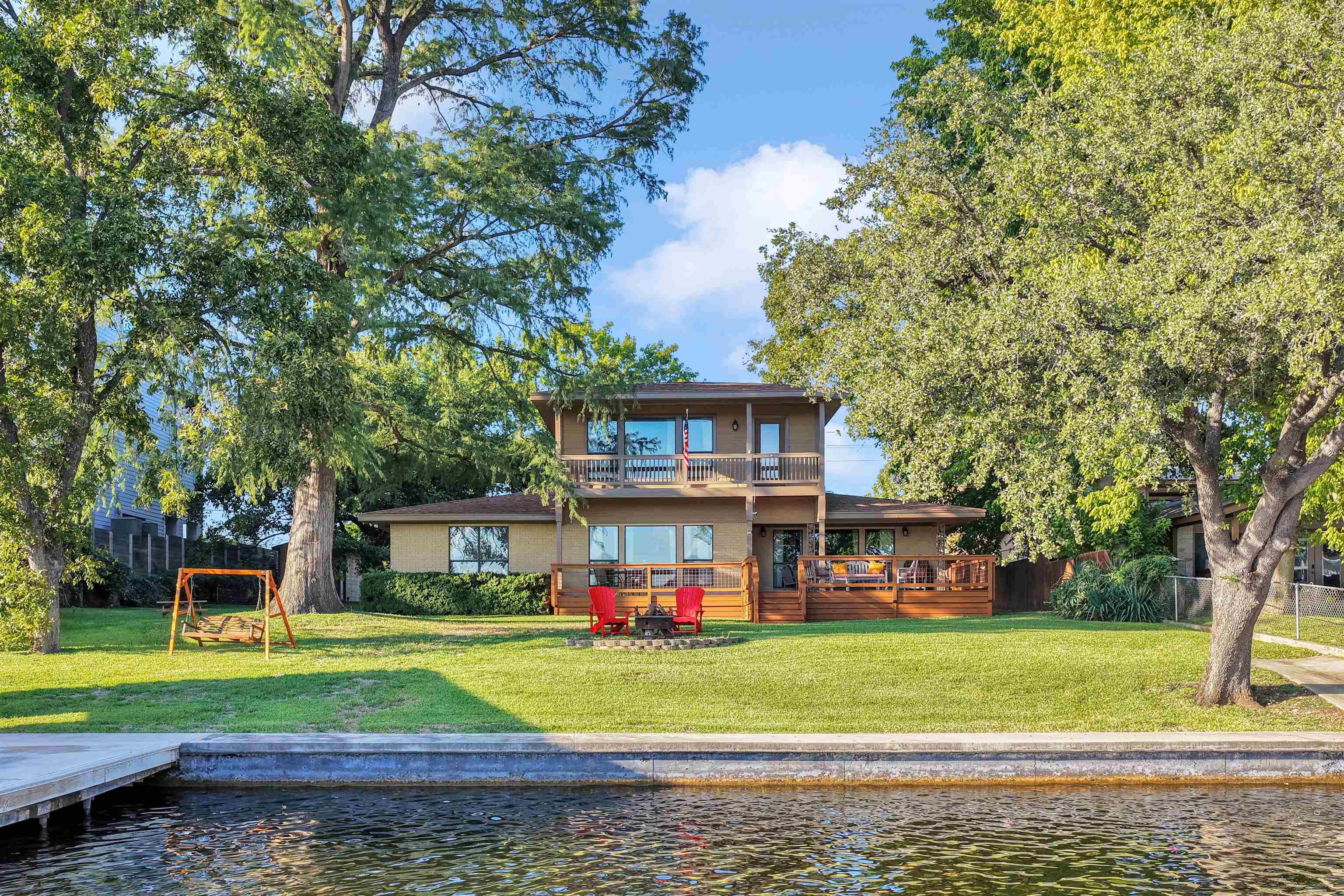 539 Ellen Williams Loop Kingsland, TX 78639 - Photo 2 of 30 a front view of a house with a yard table and chairs