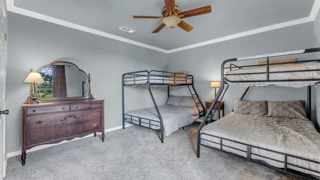 a bedroom with bed and window