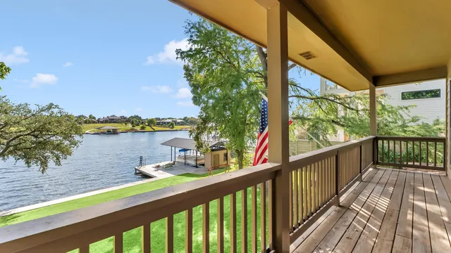 a view of a balcony with lake view and mountain view