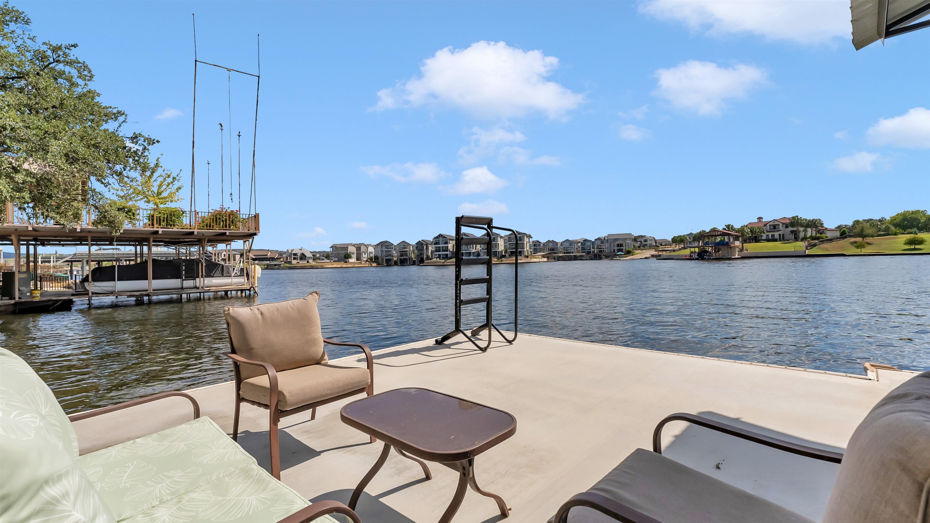 539 Ellen Williams Loop Kingsland, TX 78639 - Photo 28 of 30 a view of a lake with couches chairs
