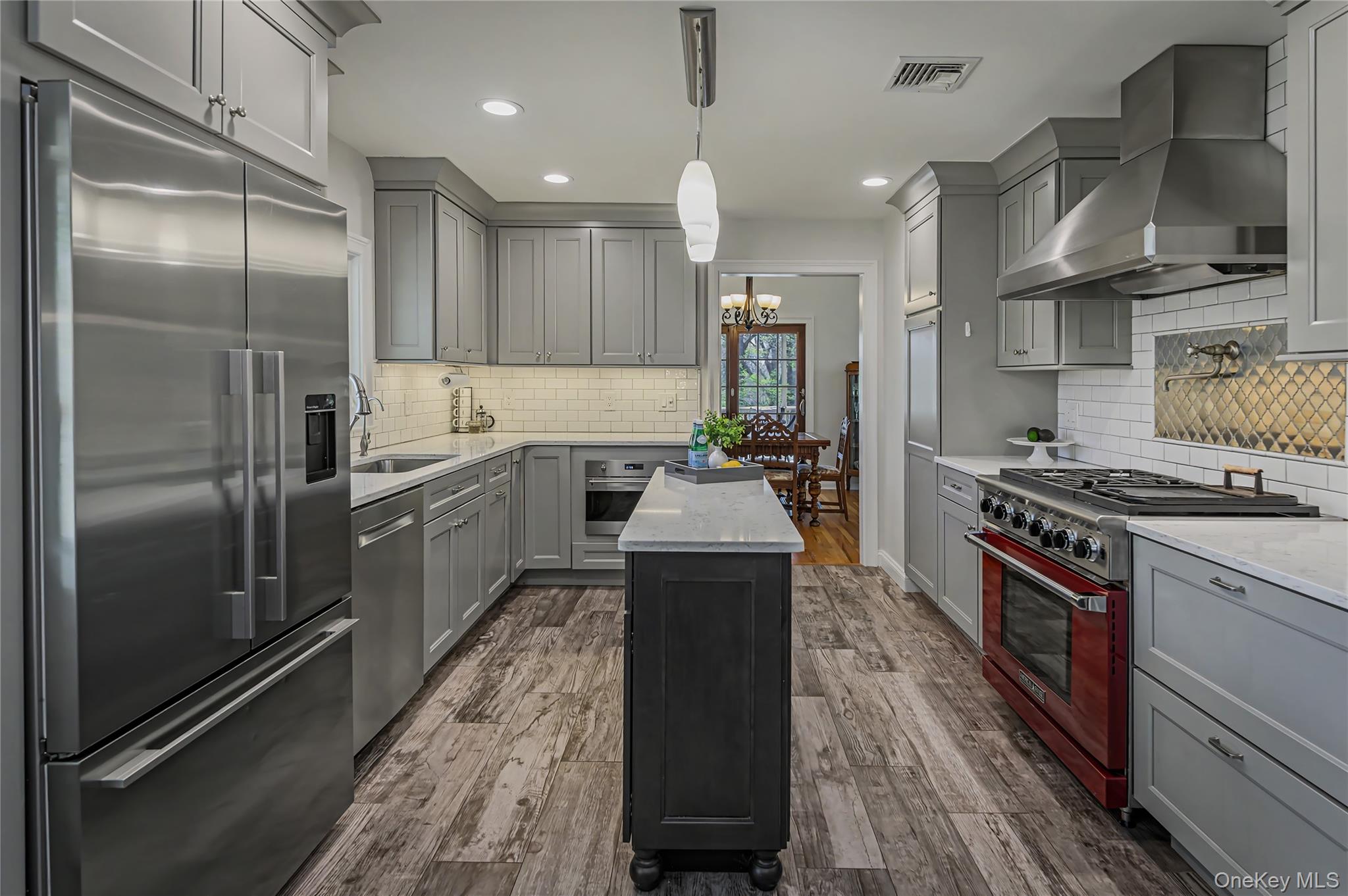 41 Cross Pond Road Pound Ridge, NY 10576 - Photo 9 of 41 a kitchen with stainless steel appliances granite countertop a sink a stove and a refrigerator