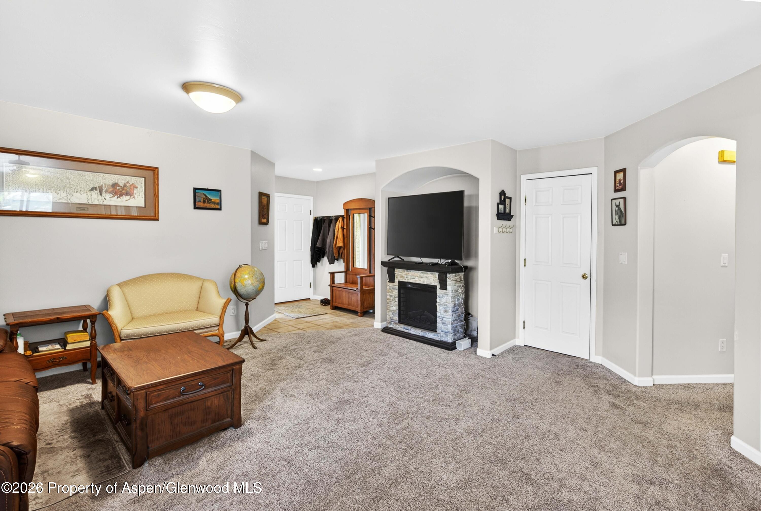 608 Lariat Loop New Castle, CO 81647 - Photo 4 of 32 a living room with furniture and a flat screen tv