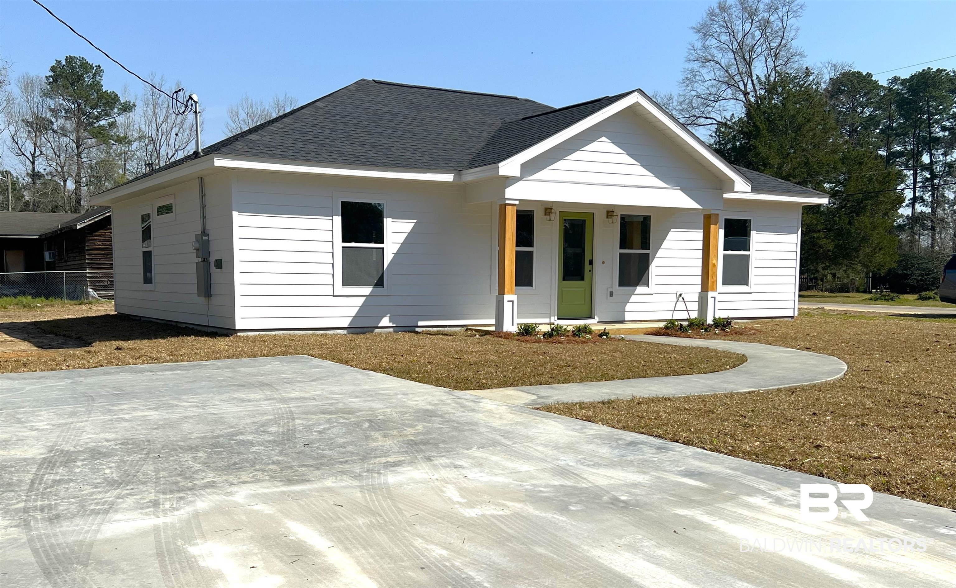 102 Earl Street Brewton, AL 36426 - Photo 19 of 27 View of front of home featuring covered porch and roof with shingles