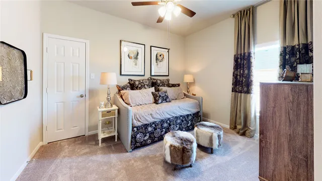 a bedroom with furniture and a chandelier