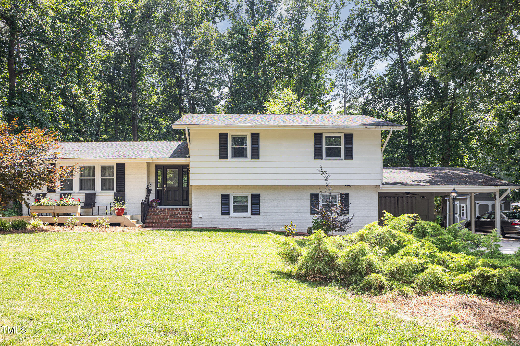 a house view with swimming pool and porch