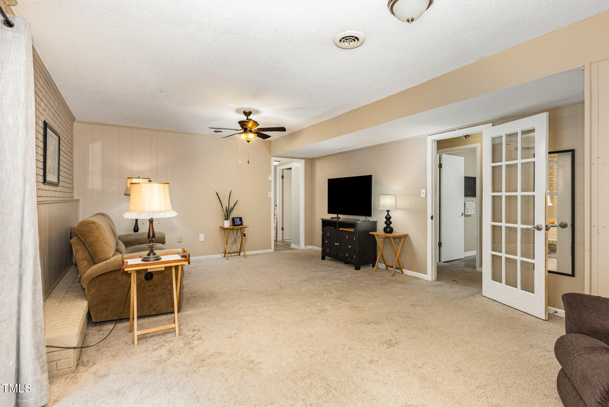 6609 Electra Drive Raleigh, NC 27607 - Photo 17 of 35 a view of a livingroom with furniture and a flat screen tv