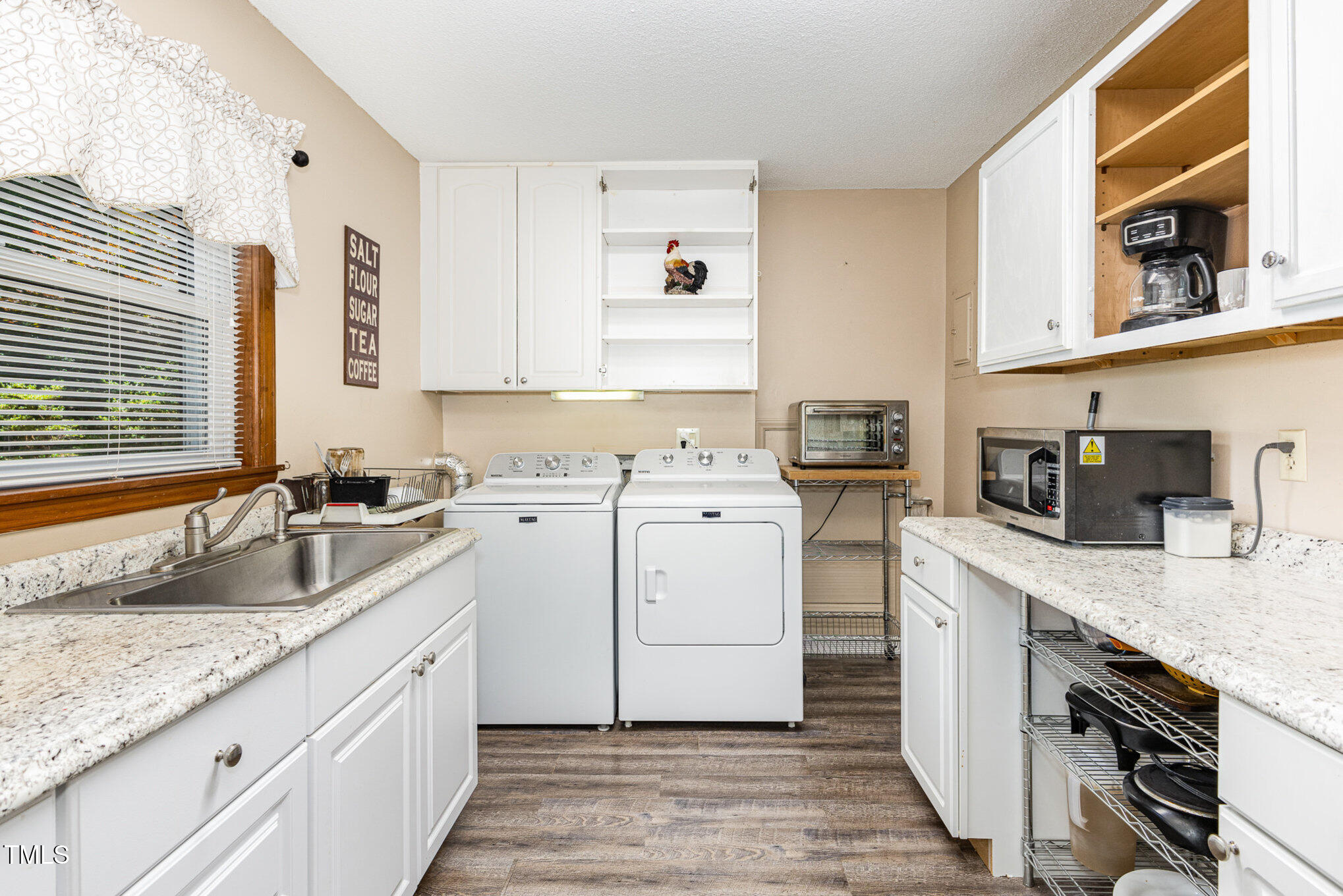 6609 Electra Drive Raleigh, NC 27607 - Photo 22 of 35 a kitchen with granite countertop a sink stove and cabinets