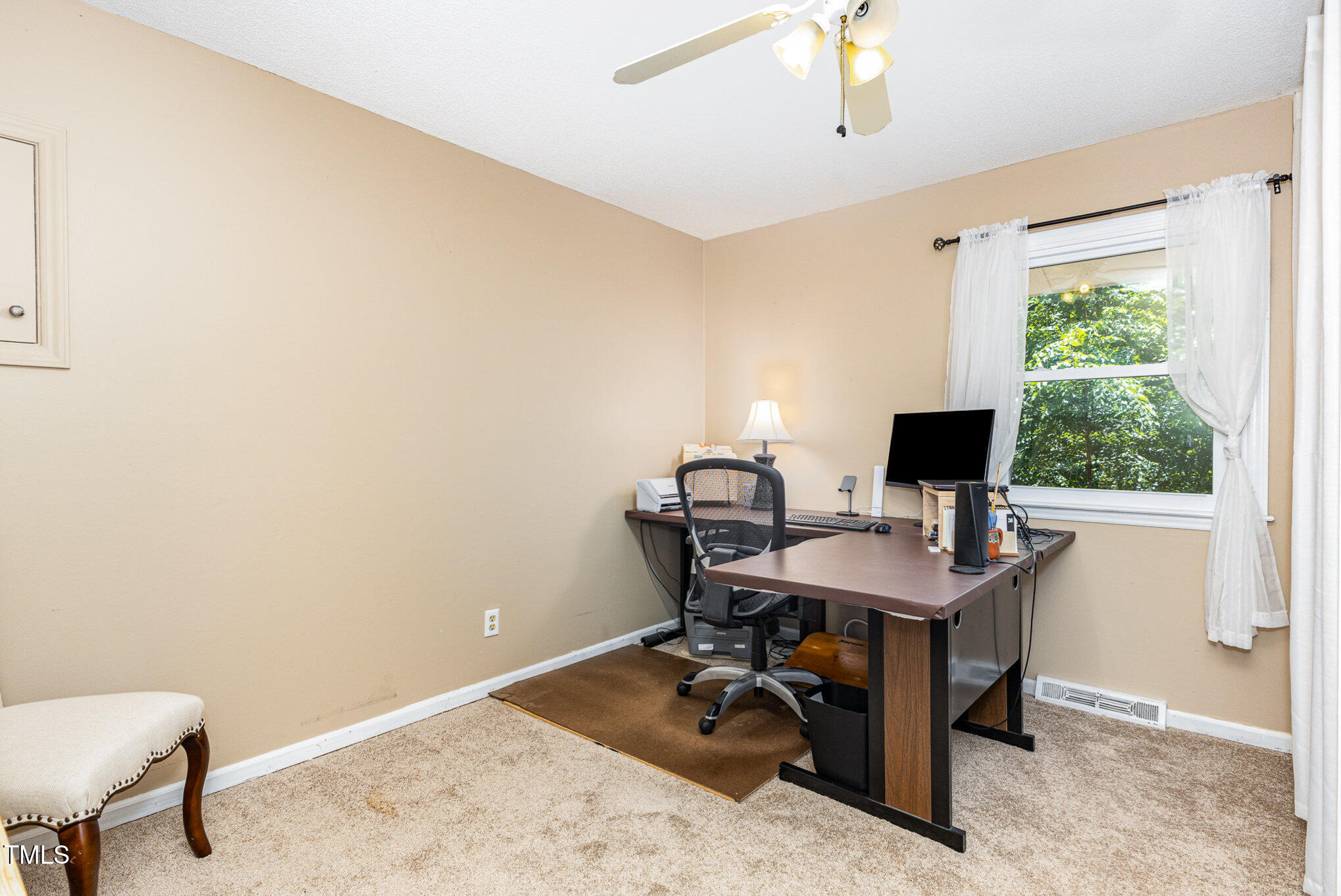6609 Electra Drive Raleigh, NC 27607 - Photo 23 of 35 a view of a workspace with furniture and a window