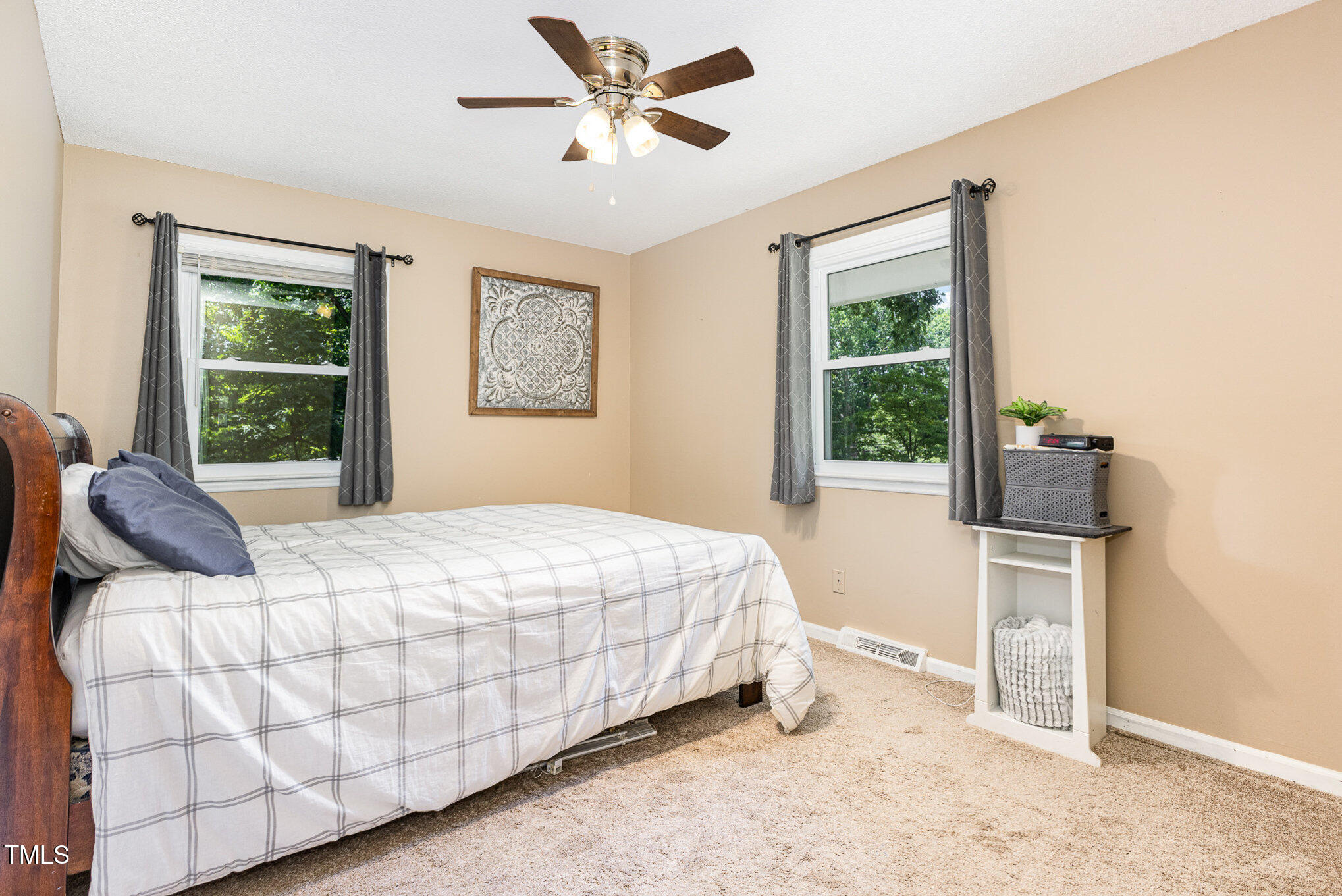 6609 Electra Drive Raleigh, NC 27607 - Photo 25 of 35 a bedroom with a bed and window