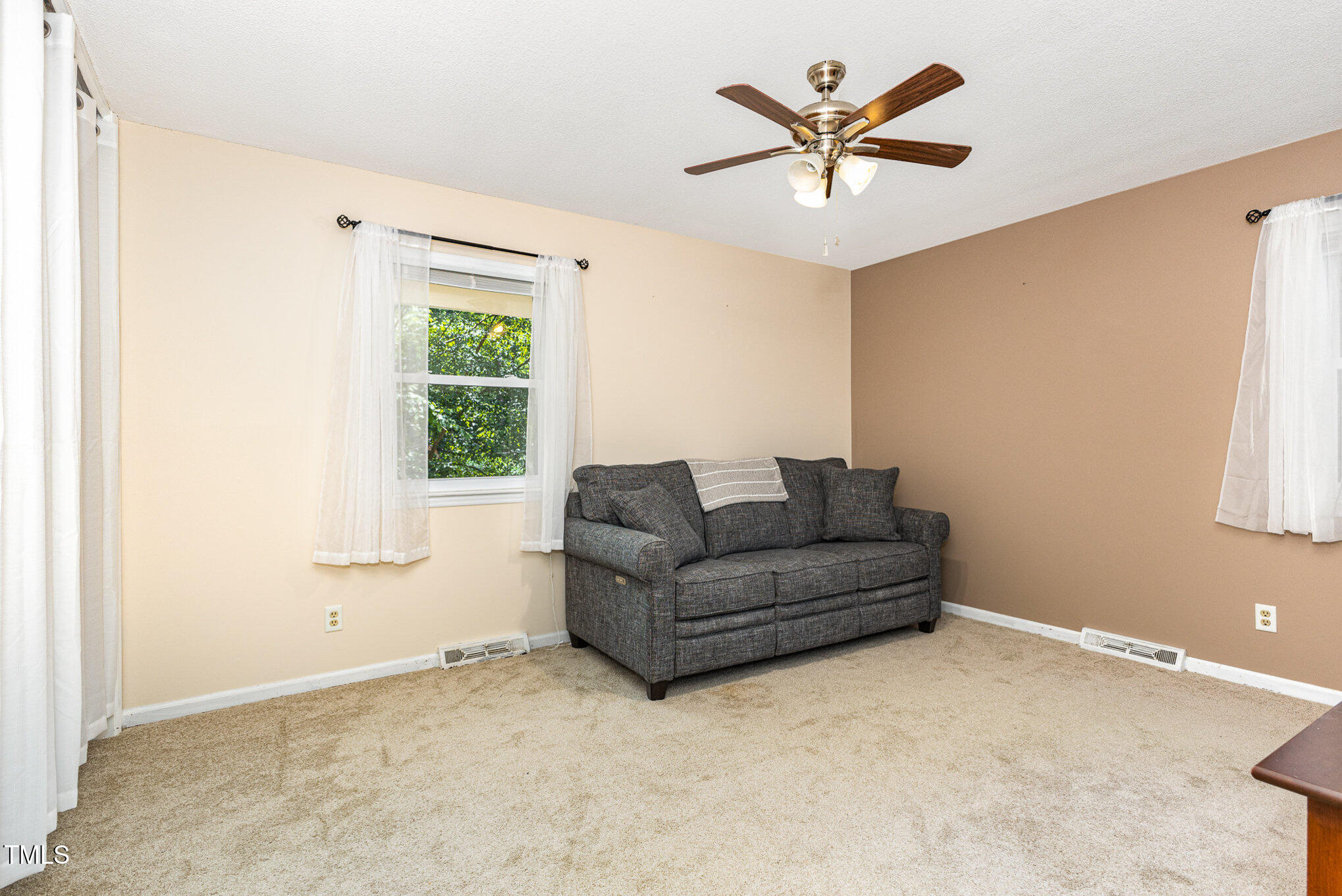 6609 Electra Drive Raleigh, NC 27607 - Photo 26 of 35 a living room with furniture and a window
