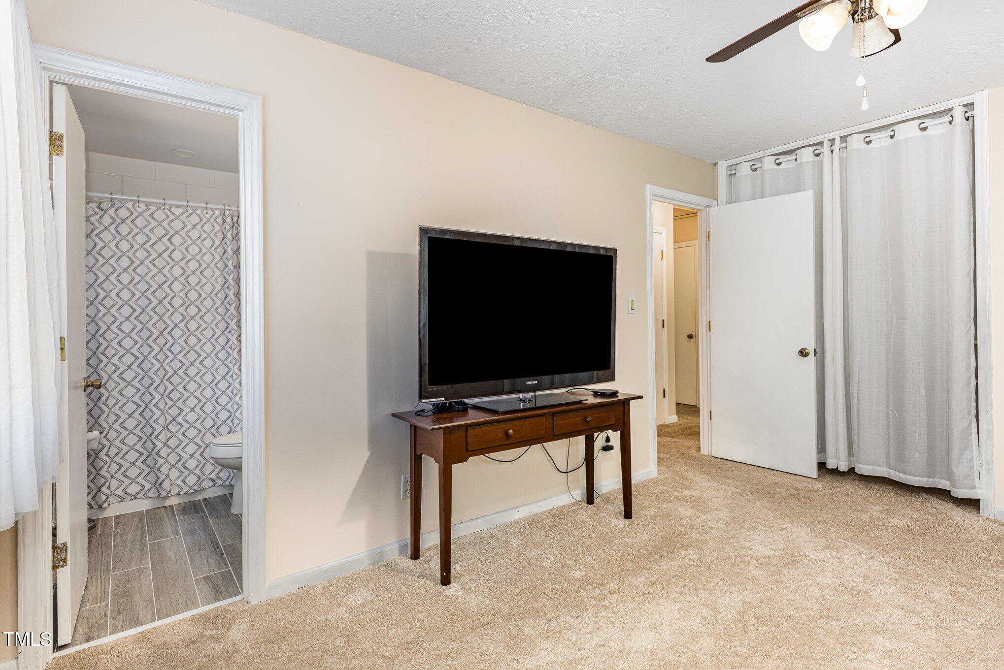 6609 Electra Drive Raleigh, NC 27607 - Photo 27 of 35 a living room with furniture and a flat screen tv