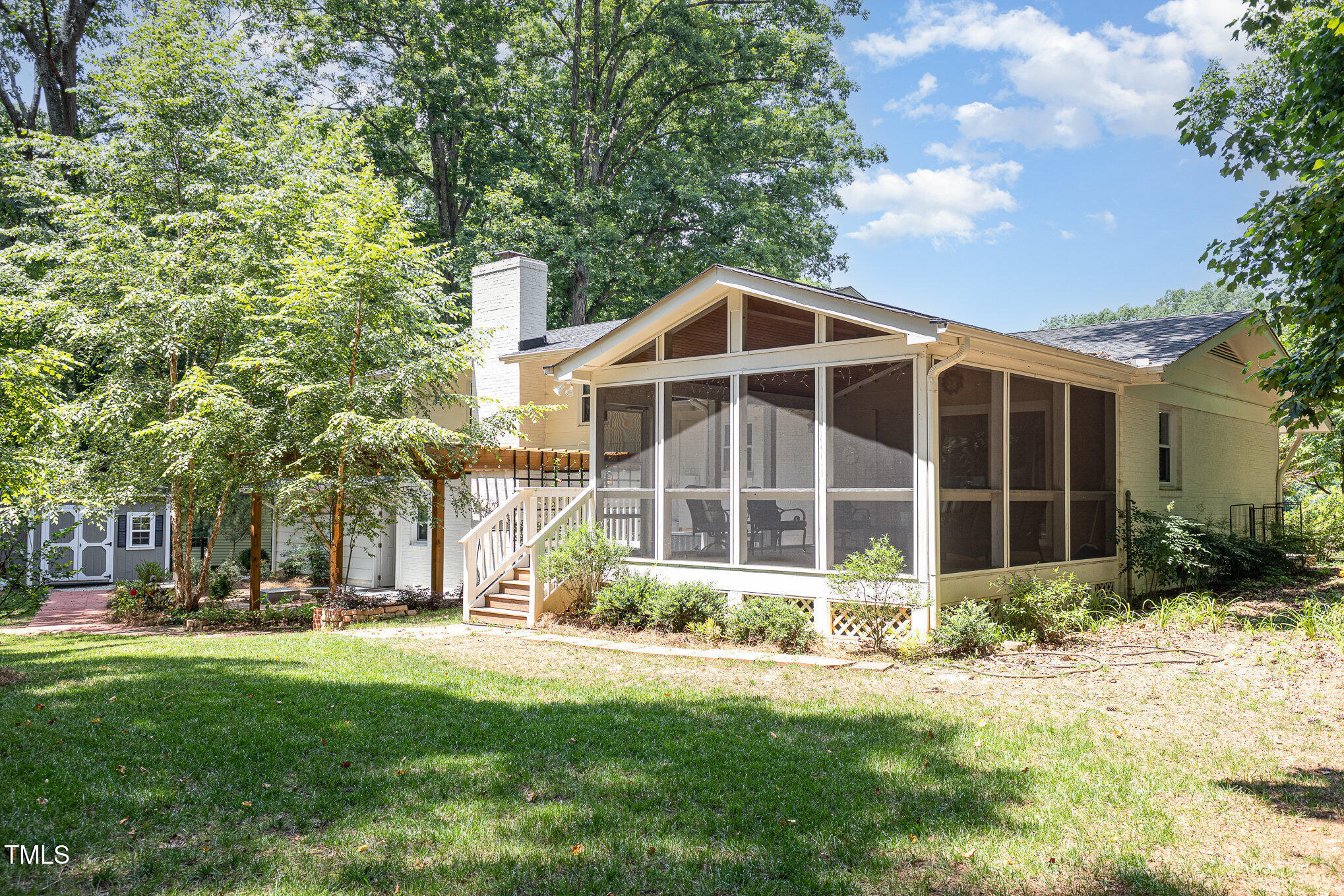 6609 Electra Drive Raleigh, NC 27607 - Photo 6 of 35 a front view of a building with a garden