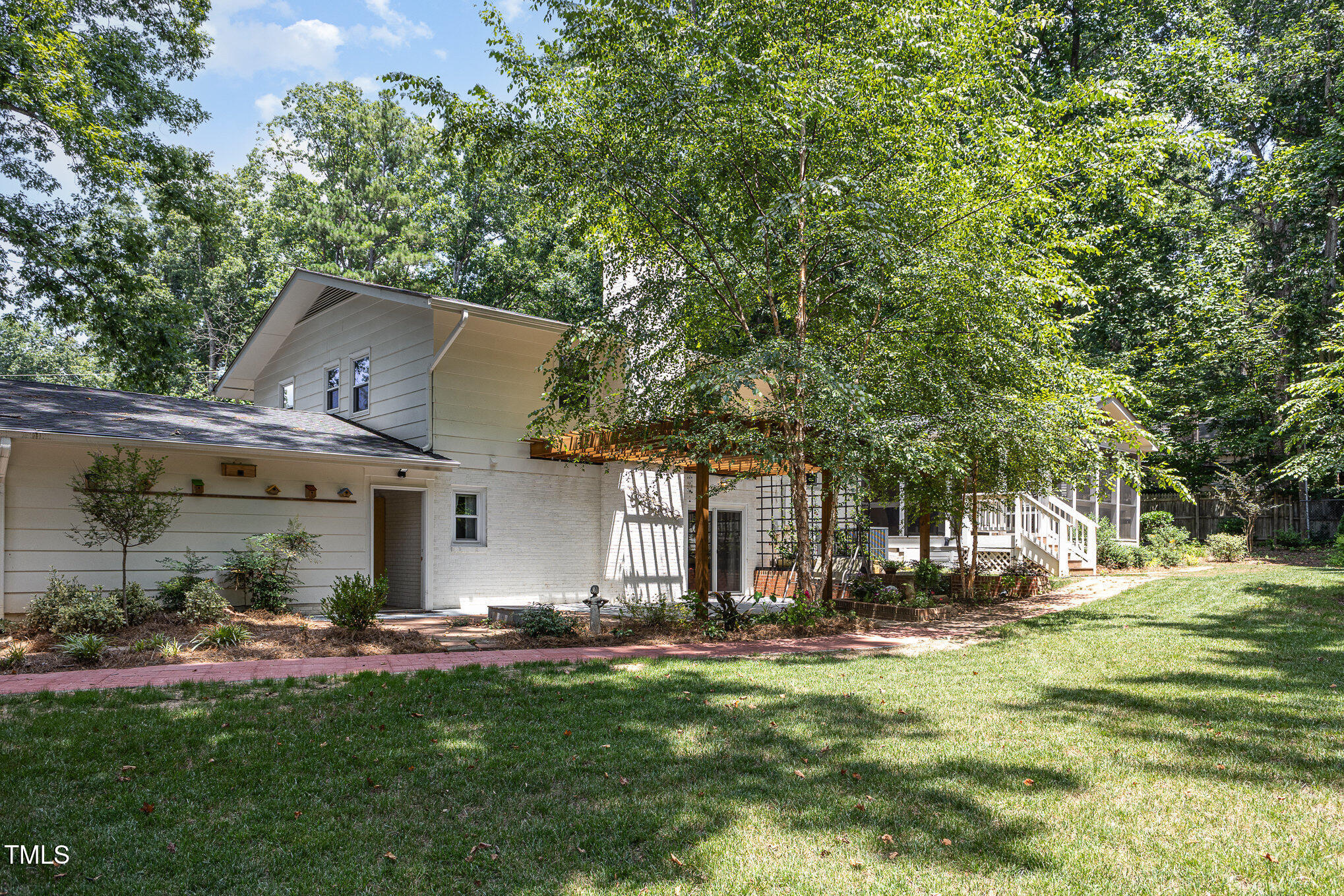 6609 Electra Drive Raleigh, NC 27607 - Photo 7 of 35 a front view of a house with a garden