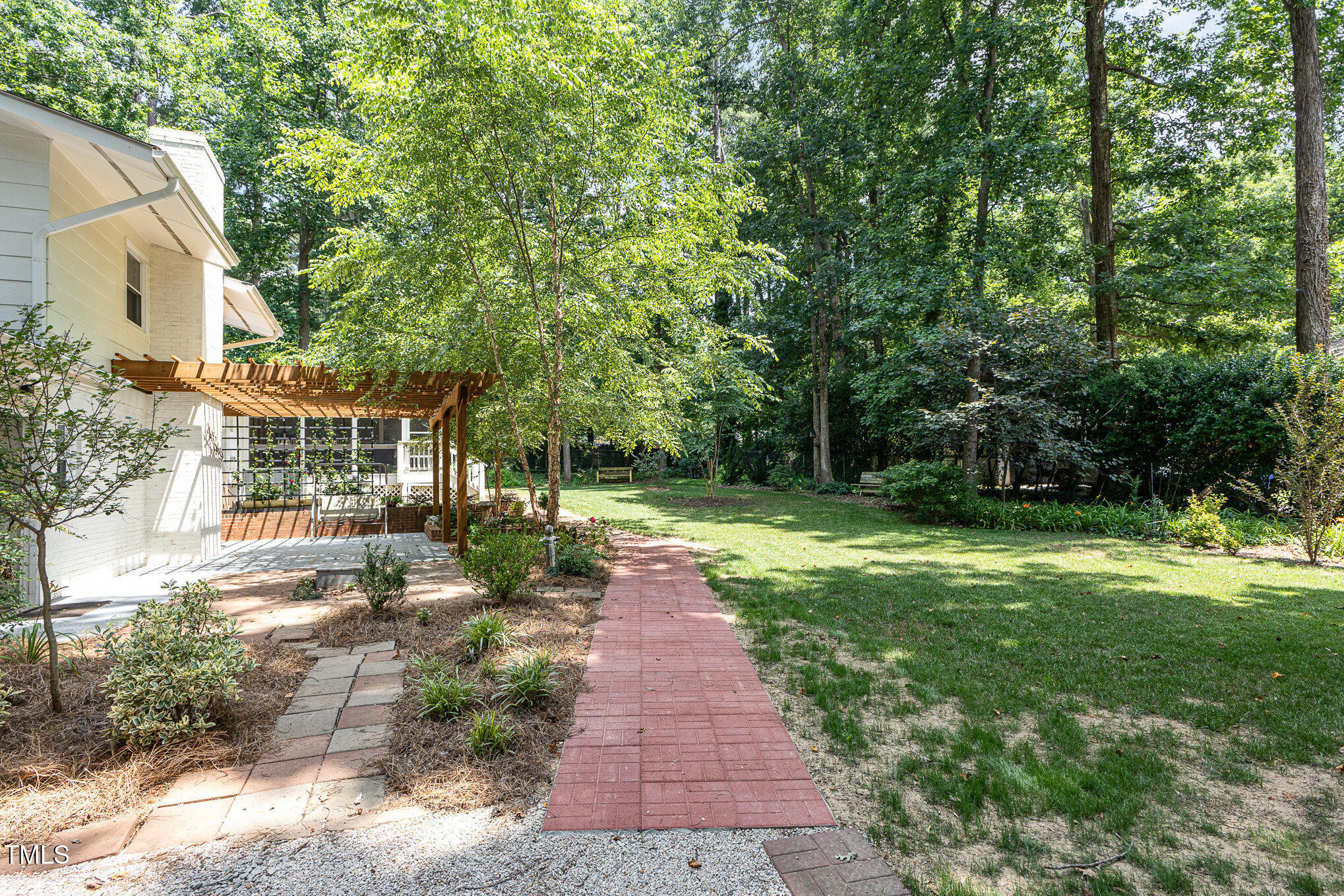 6609 Electra Drive Raleigh, NC 27607 - Photo 8 of 35 a front view of a house with garden