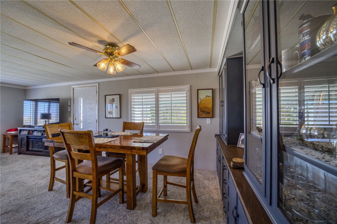 4826 Powell Lake Road Topock, AZ 86436 - Photo 11 of 58 a view of a dining room with furniture and a chandelier
